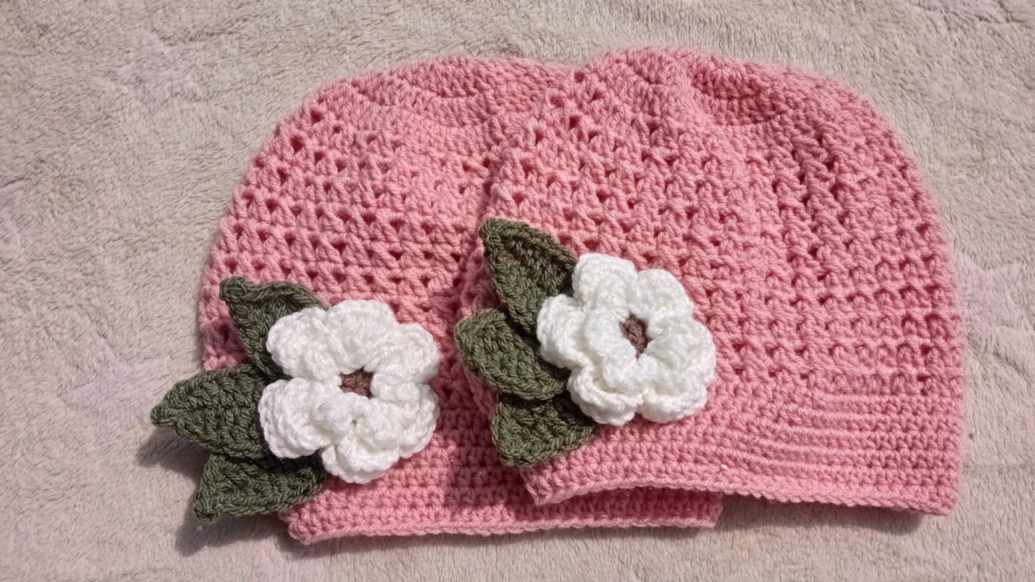 Pink Crocheted Cap with White Flower